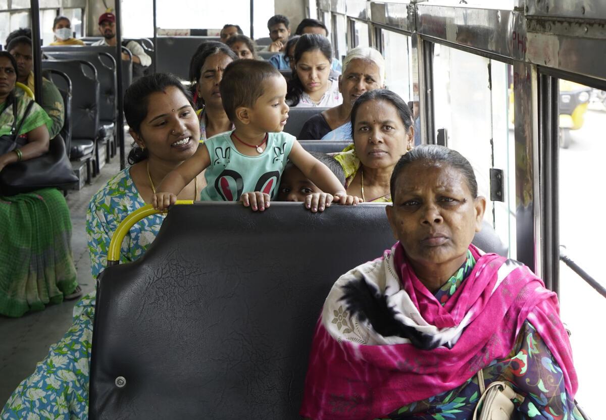 Passengers travel in a state-run bus in Hyderabad in March 2026.